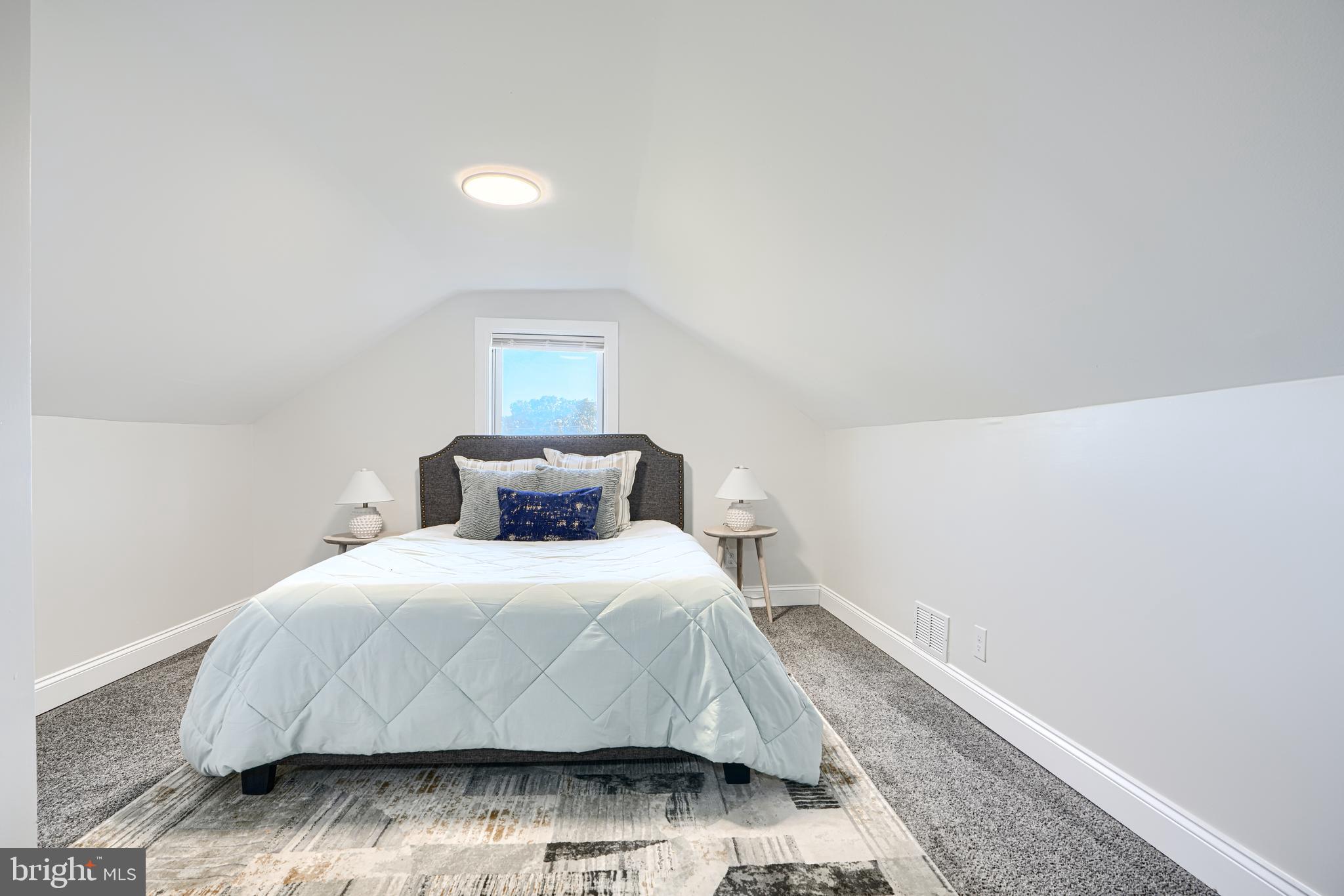 212 North Marlyn Avenue Essex, MD 21221 - Photo 42 of 54 a bedroom with a bed and a night stand