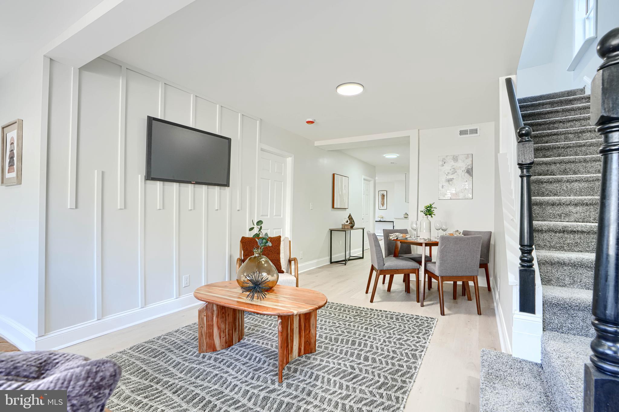 212 North Marlyn Avenue Essex, MD 21221 - Photo 6 of 54 a living room with furniture a rug and a flat screen tv