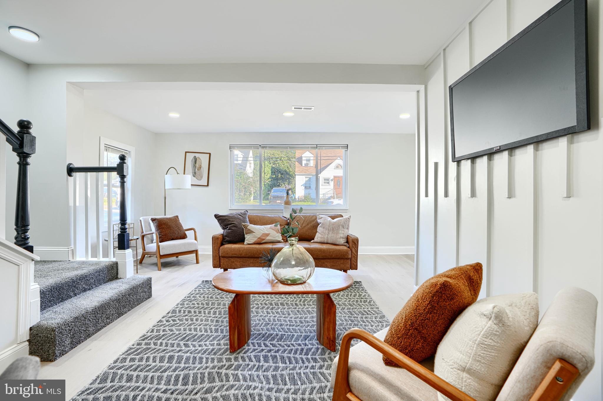 212 North Marlyn Avenue Essex, MD 21221 - Photo 10 of 54 a living room with furniture and a large window