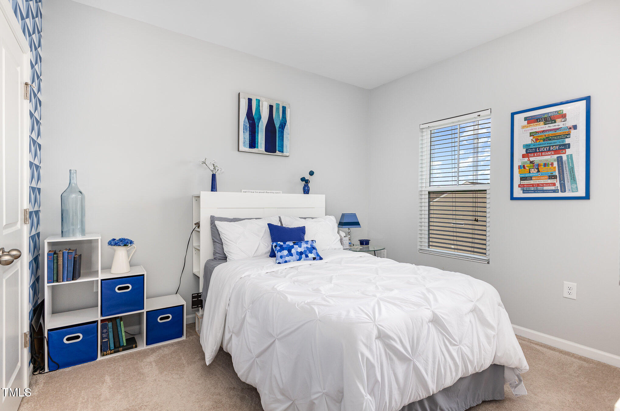 217 Jones Hill Road Holly Springs, NC 27540 - Photo 19 of 39 a bedroom with a bed and a window