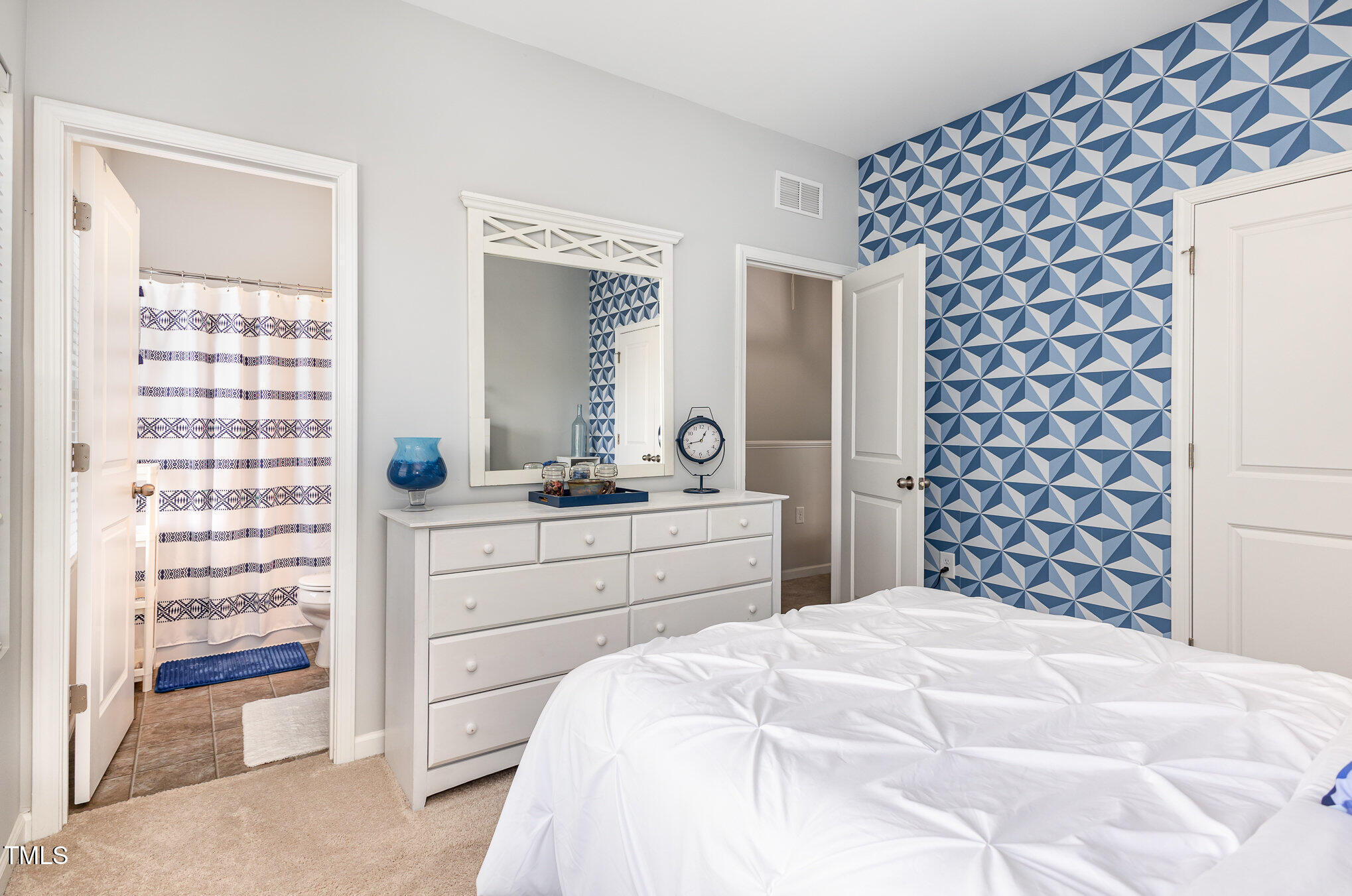 217 Jones Hill Road Holly Springs, NC 27540 - Photo 20 of 39 a bedroom with a bed and a cabinets