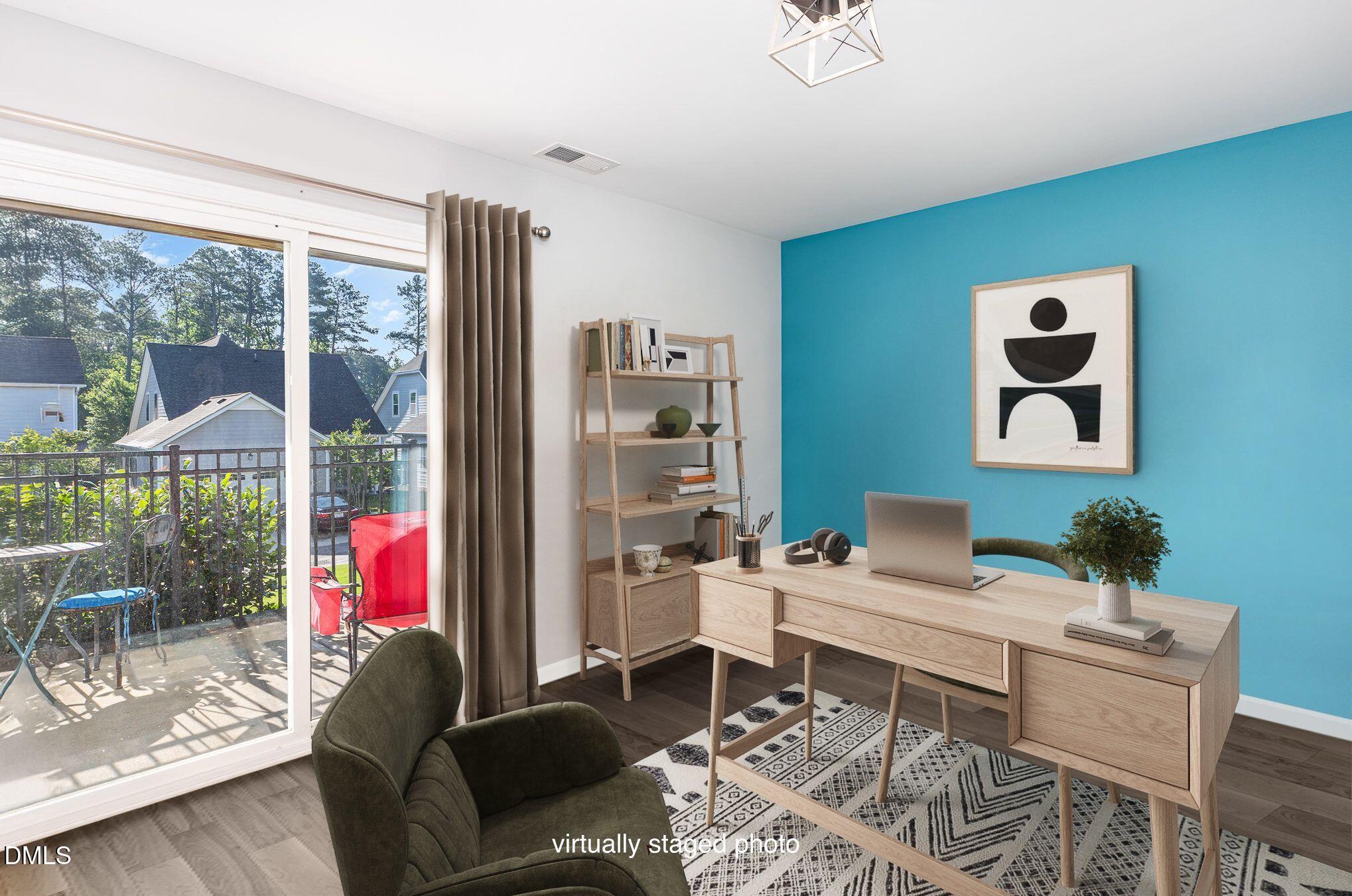 217 Jones Hill Road Holly Springs, NC 27540 - Photo 21 of 39 a living room with furniture and a floor to ceiling window