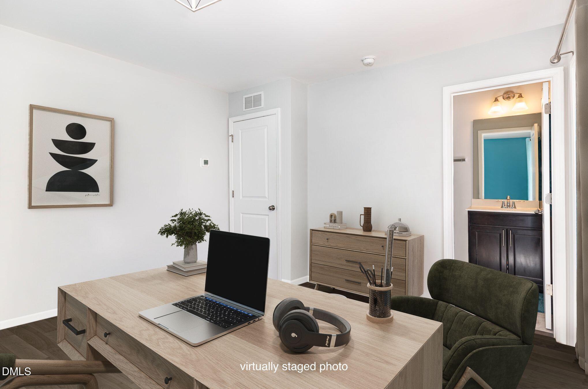 217 Jones Hill Road Holly Springs, NC 27540 - Photo 22 of 39 a workspace with furniture and lamp