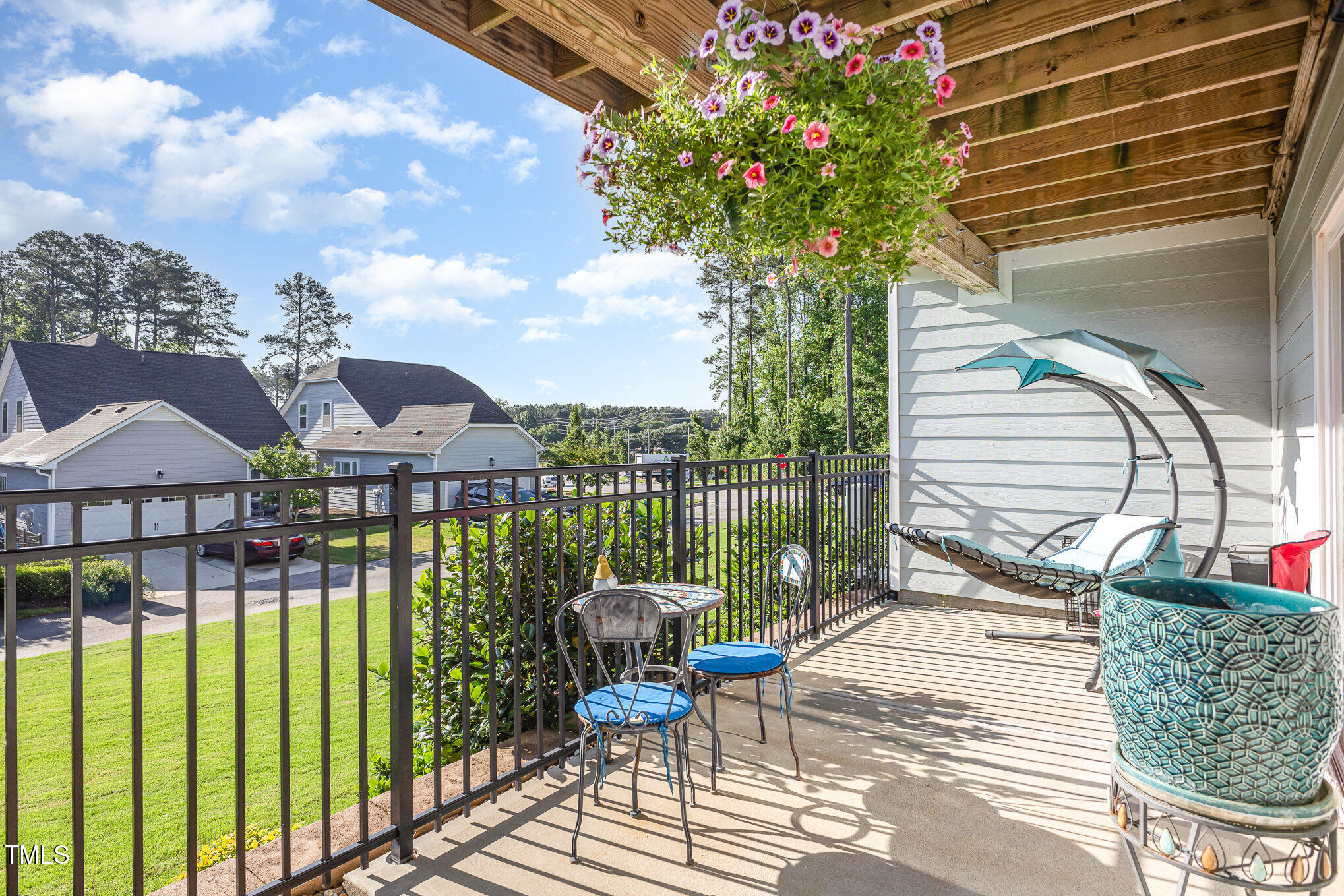 217 Jones Hill Road Holly Springs, NC 27540 - Photo 26 of 39 a view of a chair and tables in the balcony