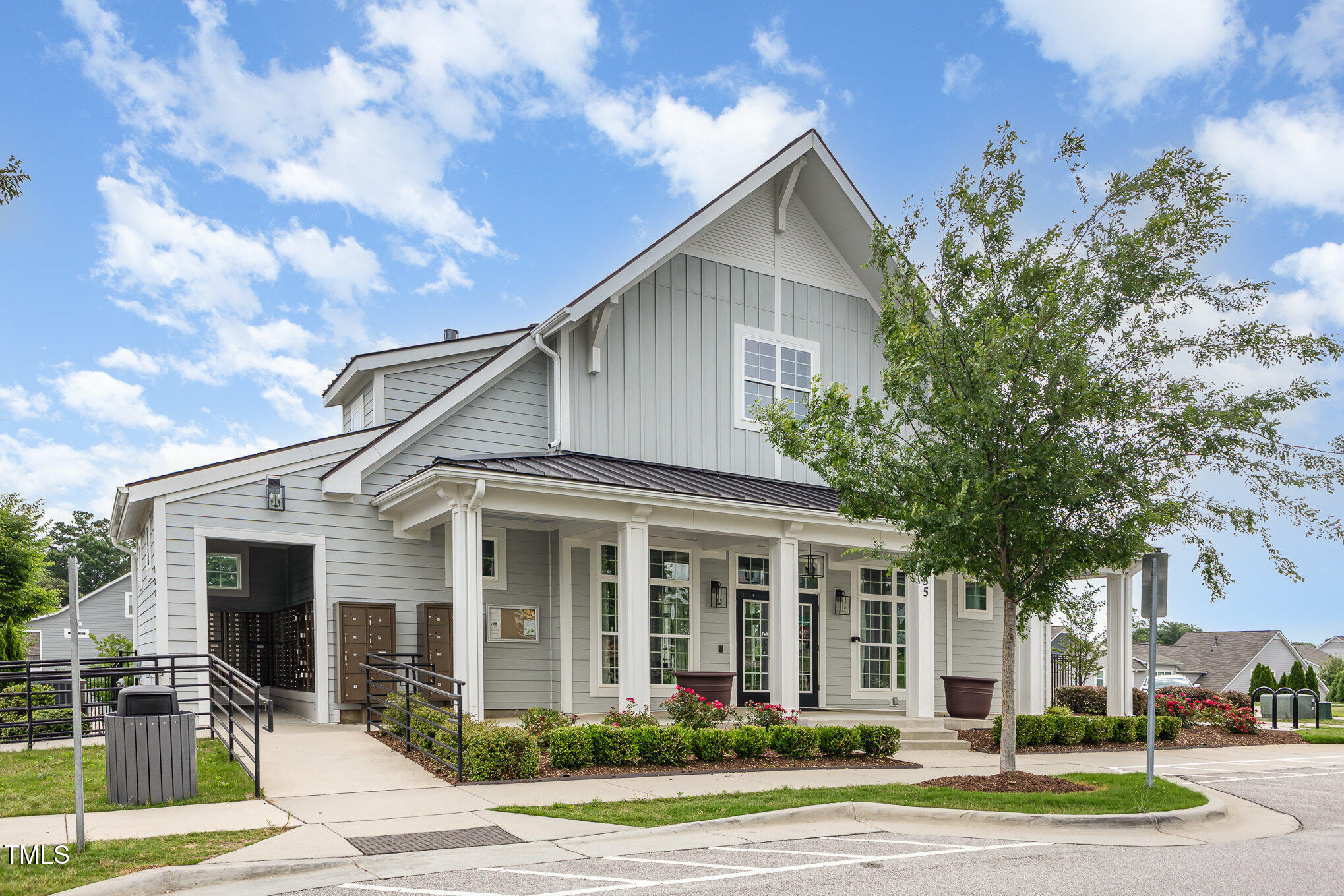 217 Jones Hill Road Holly Springs, NC 27540 - Photo 33 of 39 a view of a white house with a yard plants and large tree