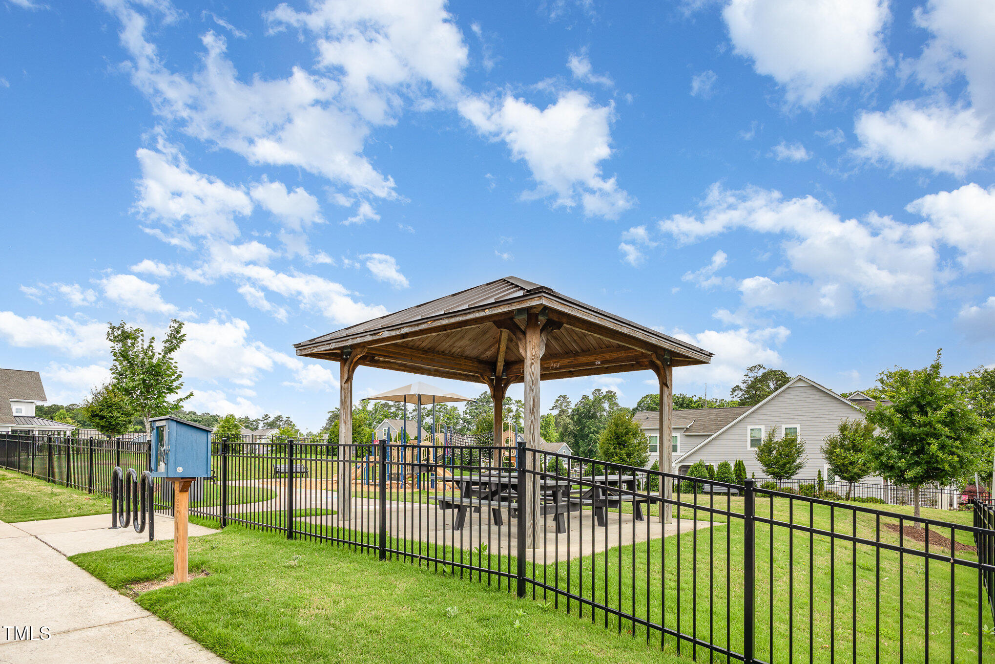 217 Jones Hill Road Holly Springs, NC 27540 - Photo 35 of 39 a view of a yard in front of a house with a swimming pool