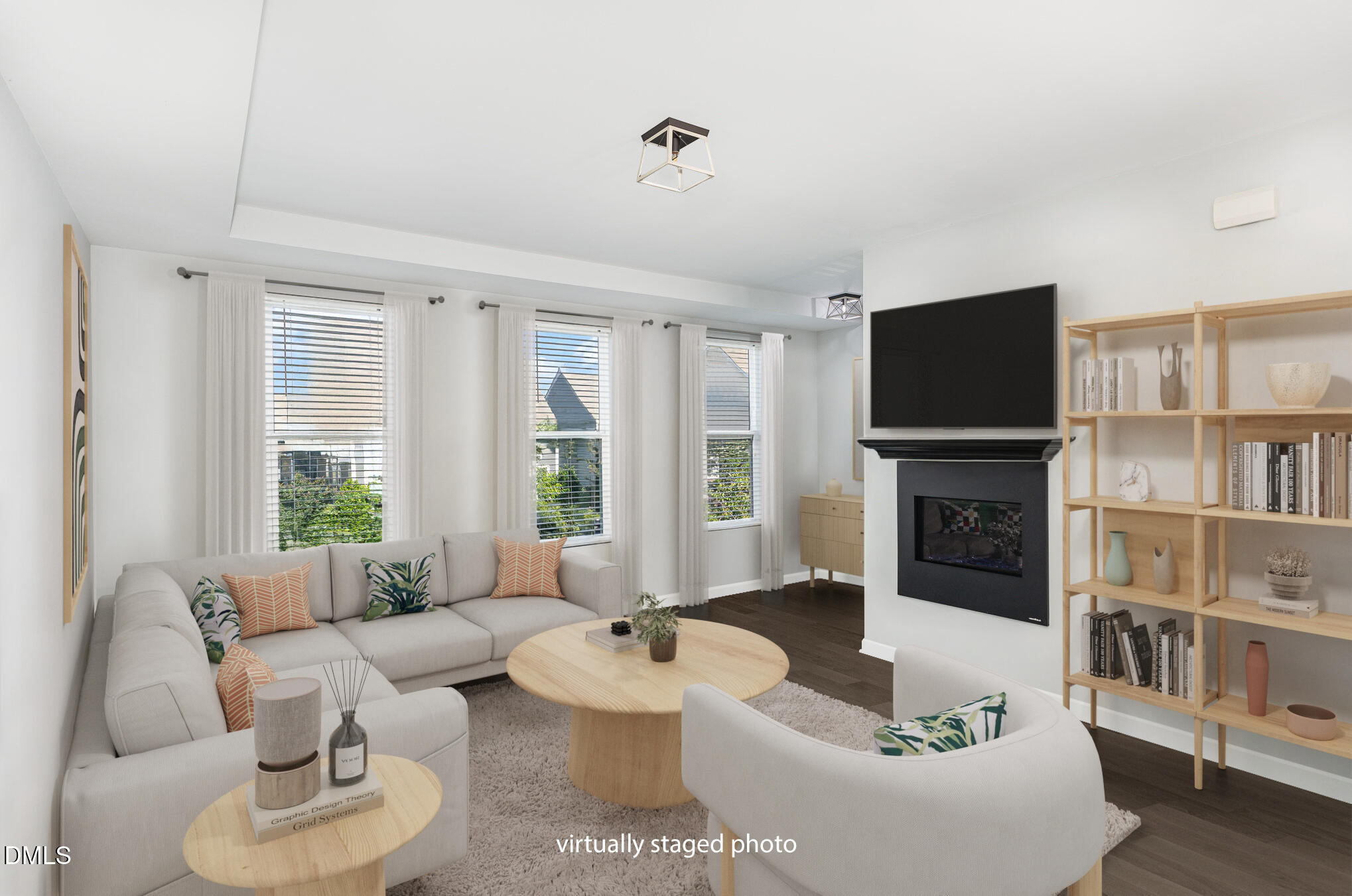 217 Jones Hill Road Holly Springs, NC 27540 - Photo 7 of 39 a living room with furniture a flat screen tv and a fireplace