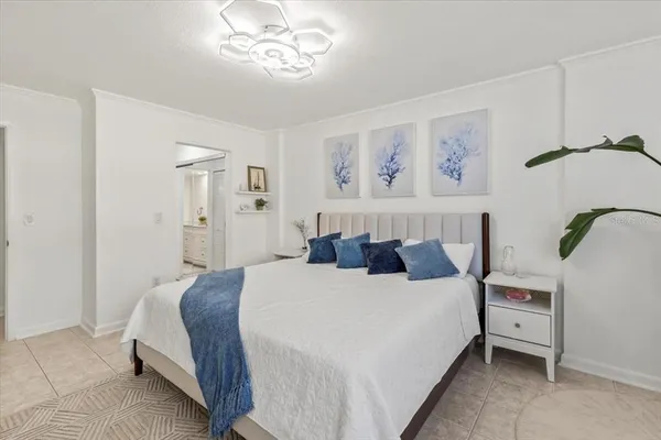 a en suite spacious bathroom with a tub shower and bedroom