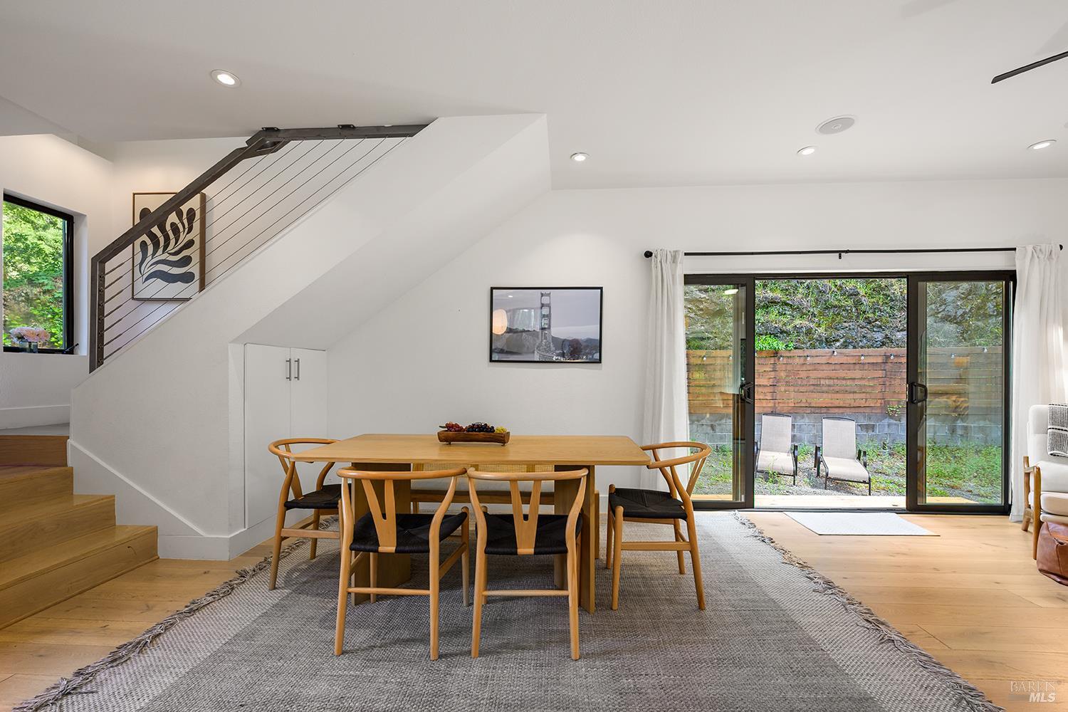 2563 Mill Creek Road Healdsburg, CA 95448 - Photo 12 of 42 a dining room with furniture and a floor to ceiling window