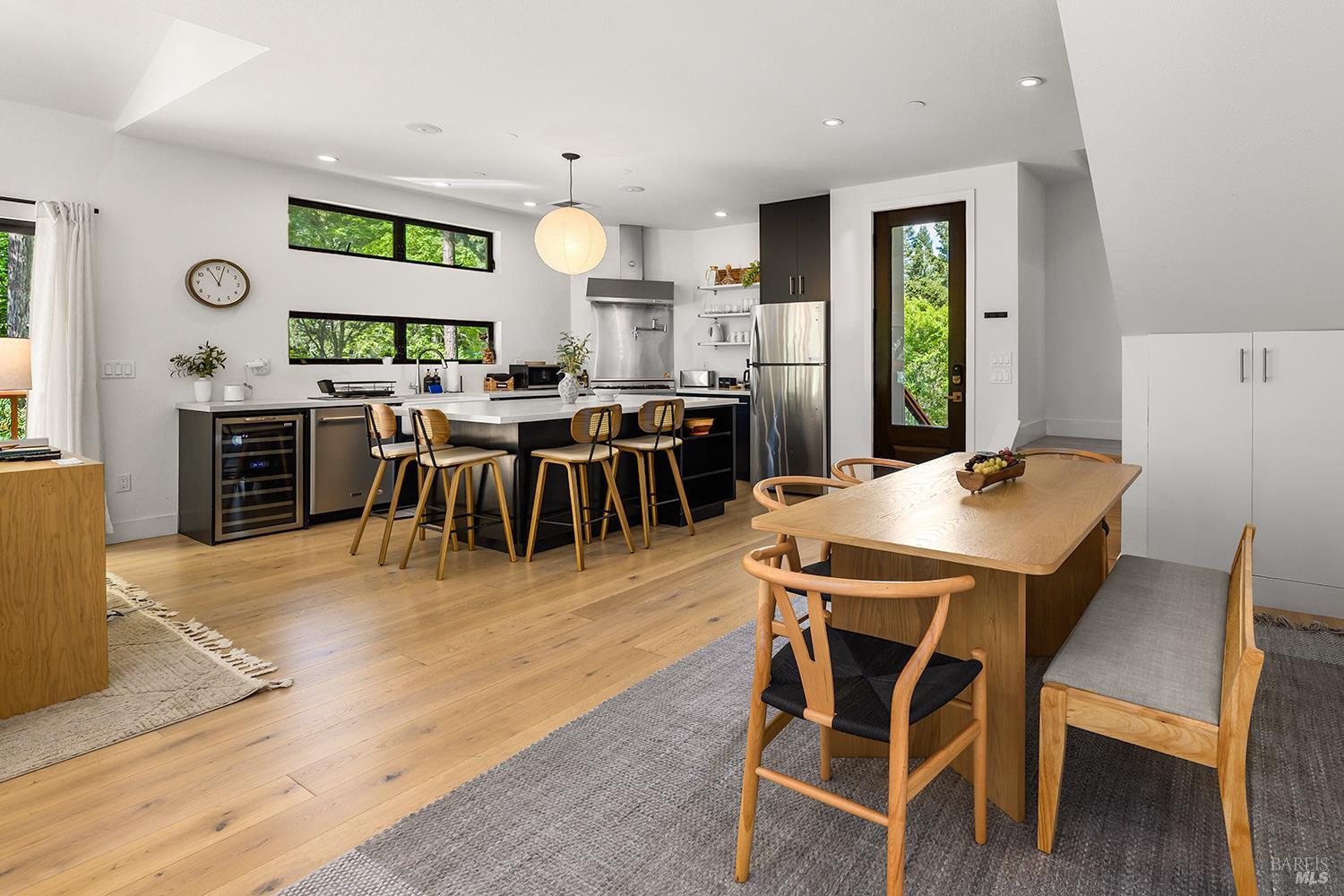 2563 Mill Creek Road Healdsburg, CA 95448 - Photo 19 of 42 a view of a dining room with furniture and wooden floor