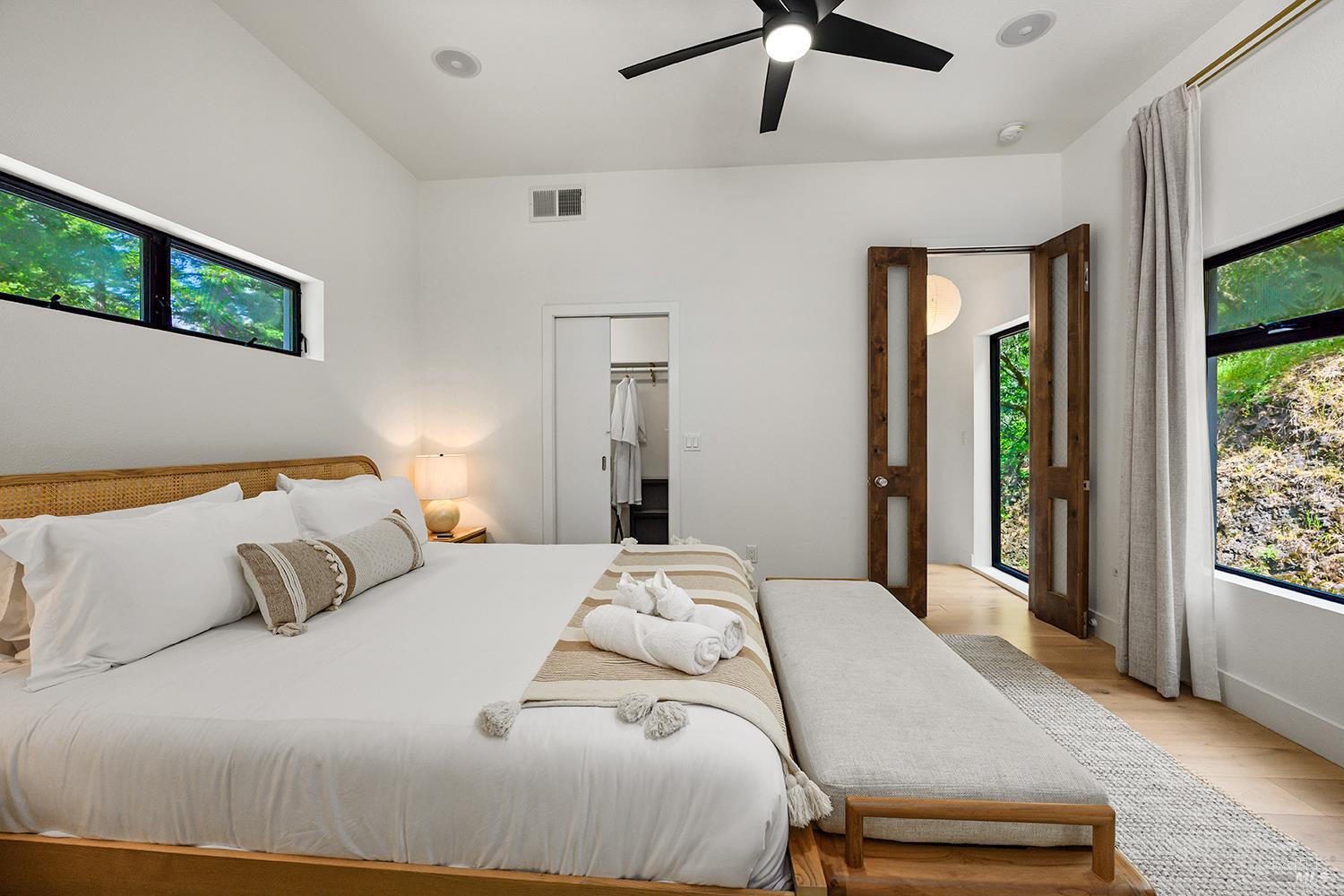 2563 Mill Creek Road Healdsburg, CA 95448 - Photo 21 of 42 a bedroom with a bed and a large window