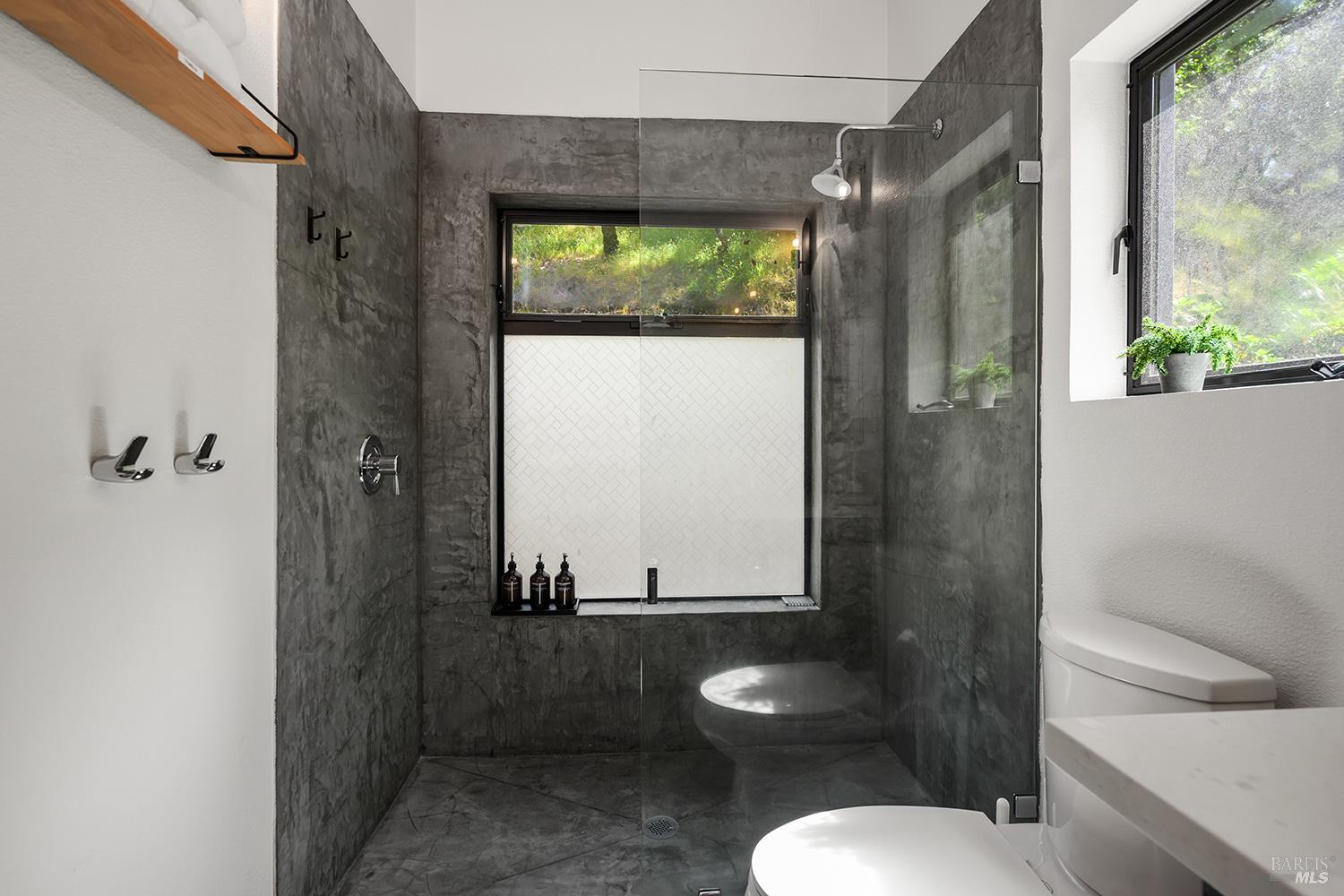 2563 Mill Creek Road Healdsburg, CA 95448 - Photo 22 of 42 a bathroom with a toilet sink and mirror