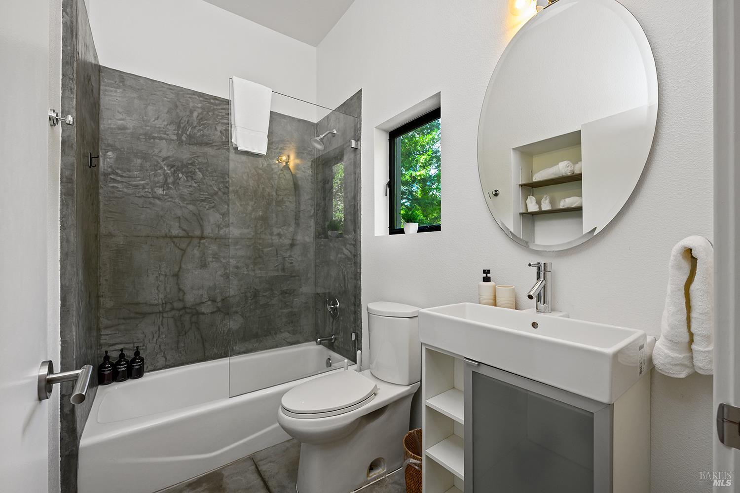 2563 Mill Creek Road Healdsburg, CA 95448 - Photo 25 of 42 a bathroom with a sink toilet and shower