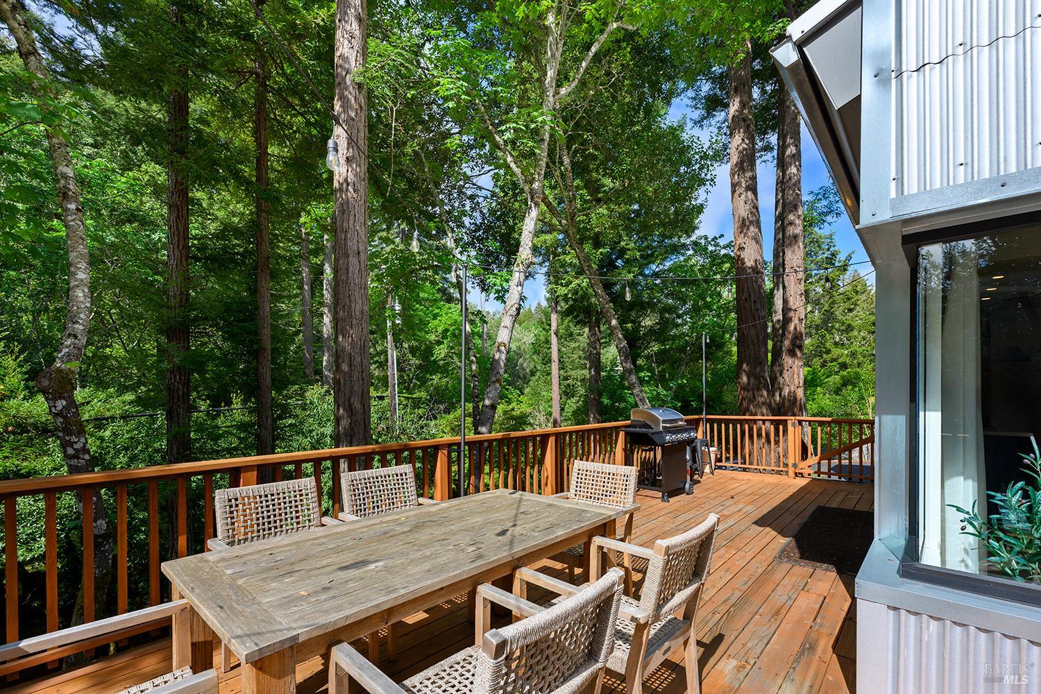 2563 Mill Creek Road Healdsburg, CA 95448 - Photo 31 of 42 a view of a patio with a table chairs and a couches