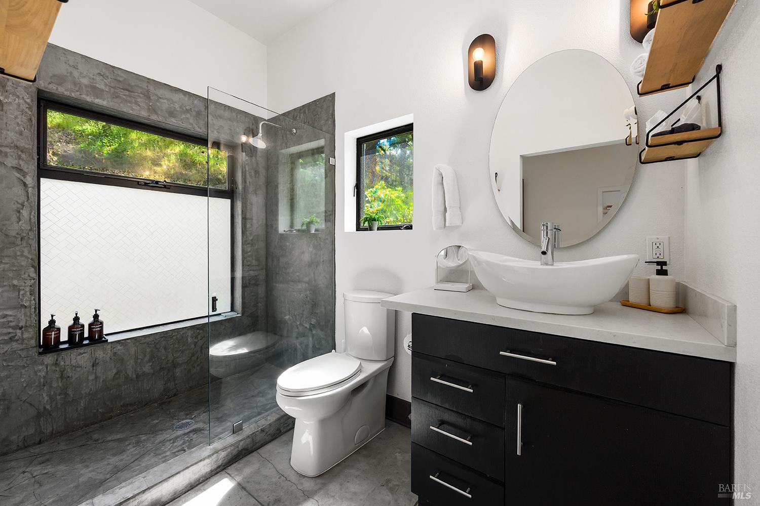 2563 Mill Creek Road Healdsburg, CA 95448 - Photo 7 of 42 a bathroom with a sink a toilet and mirror