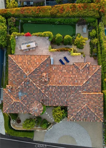 a living room with furniture fireplace and a large window