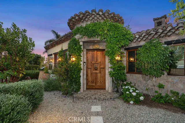 a building outdoor space with patio furniture and potted plants