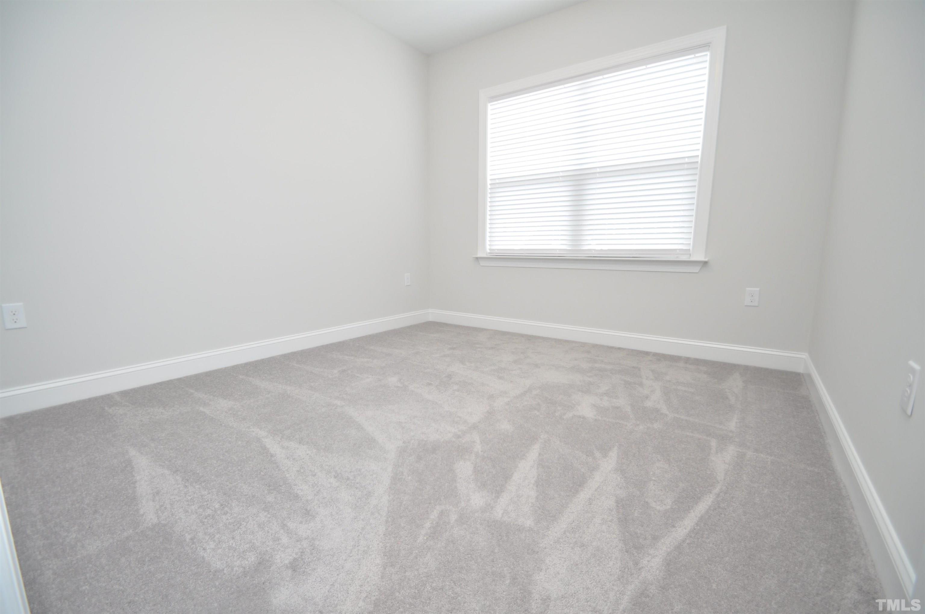 2949 Rise And Shine Road Apex, NC 27523 - Photo 17 of 49 an empty room with a window
