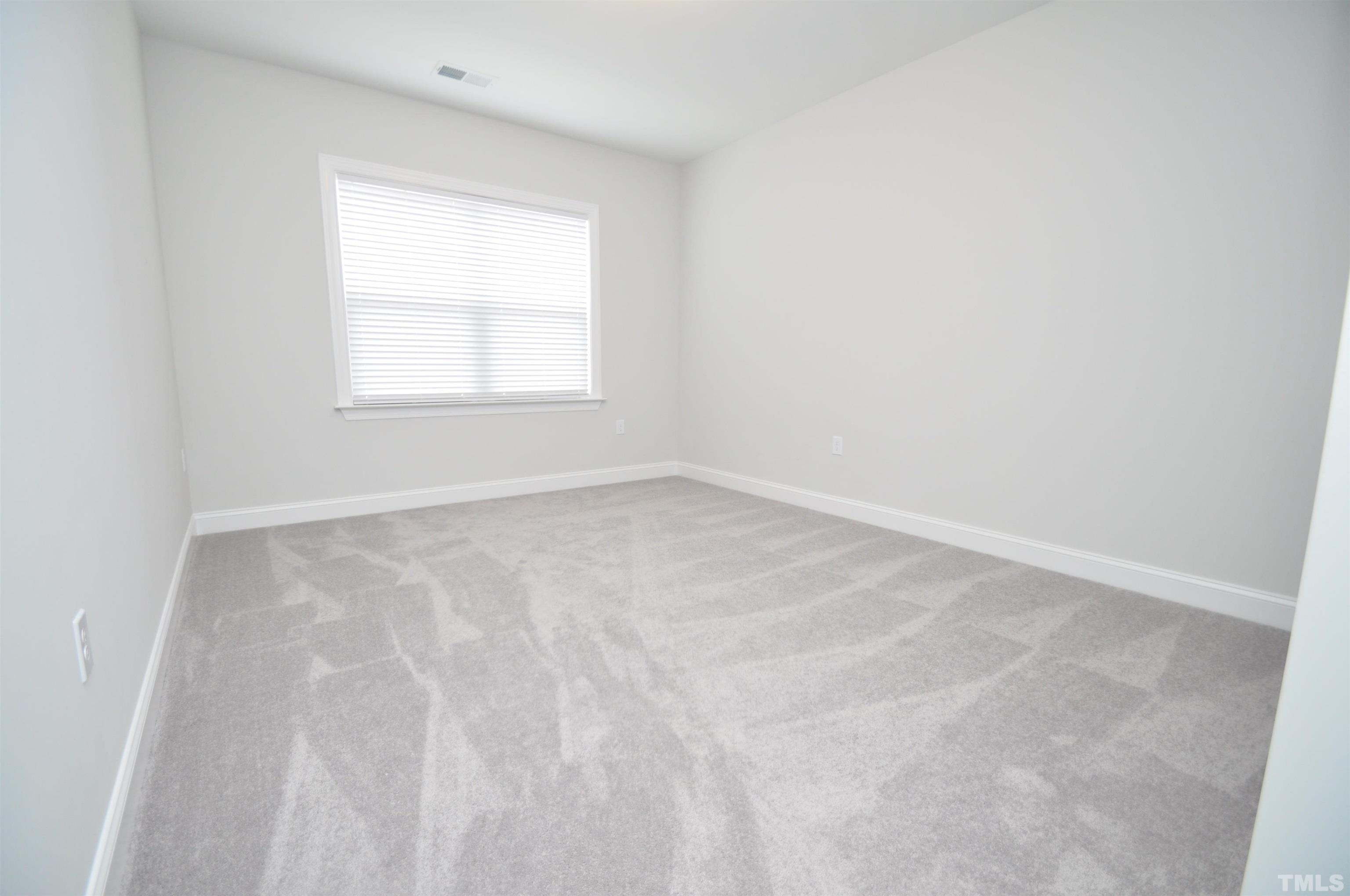 2949 Rise And Shine Road Apex, NC 27523 - Photo 19 of 49 an empty room with a window