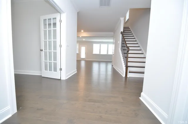 a view of gallery with wooden floor