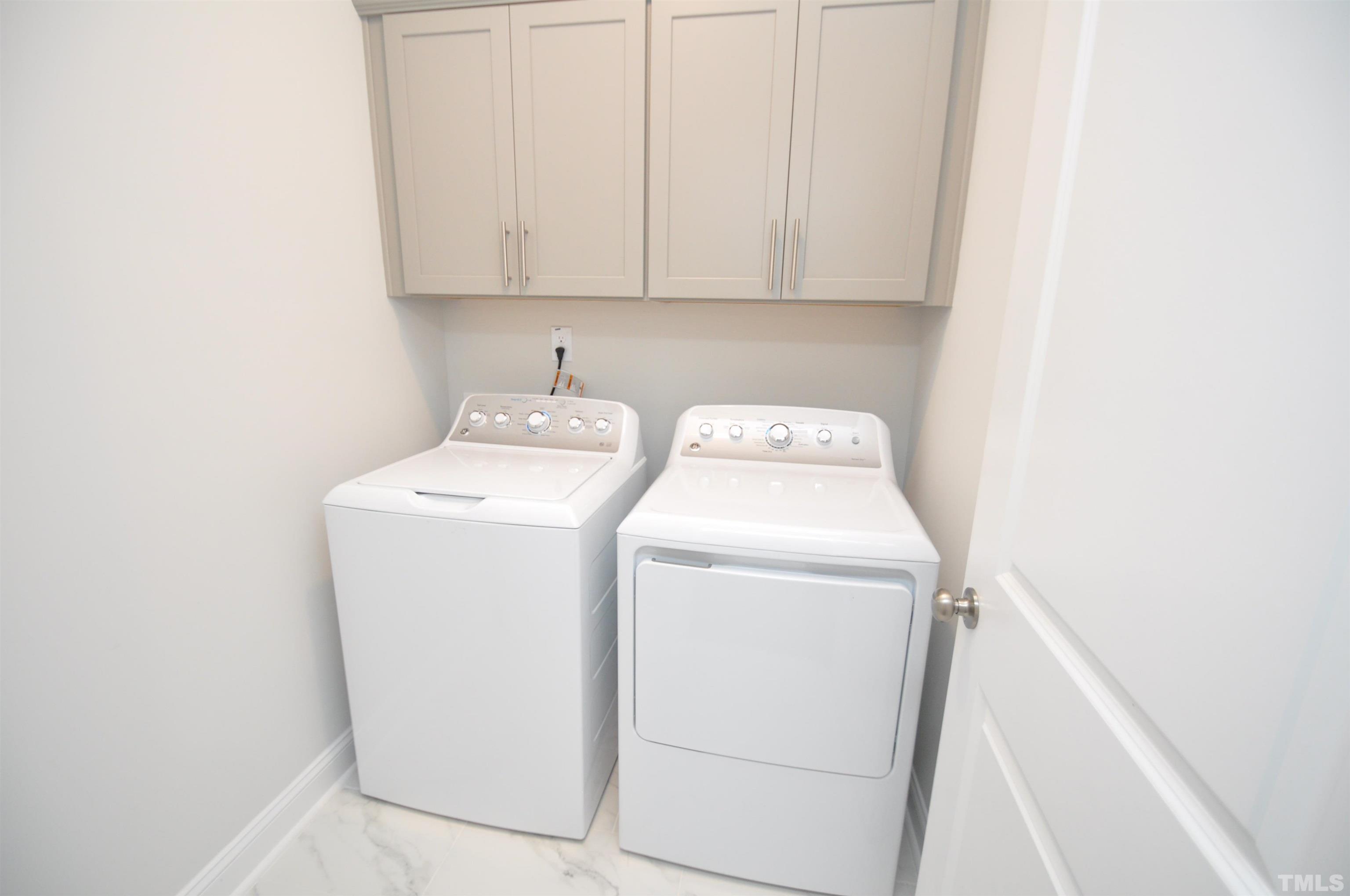 2949 Rise And Shine Road Apex, NC 27523 - Photo 23 of 49 a utility room with dryer and washer