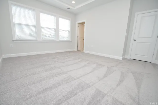an empty room with mirror in closet