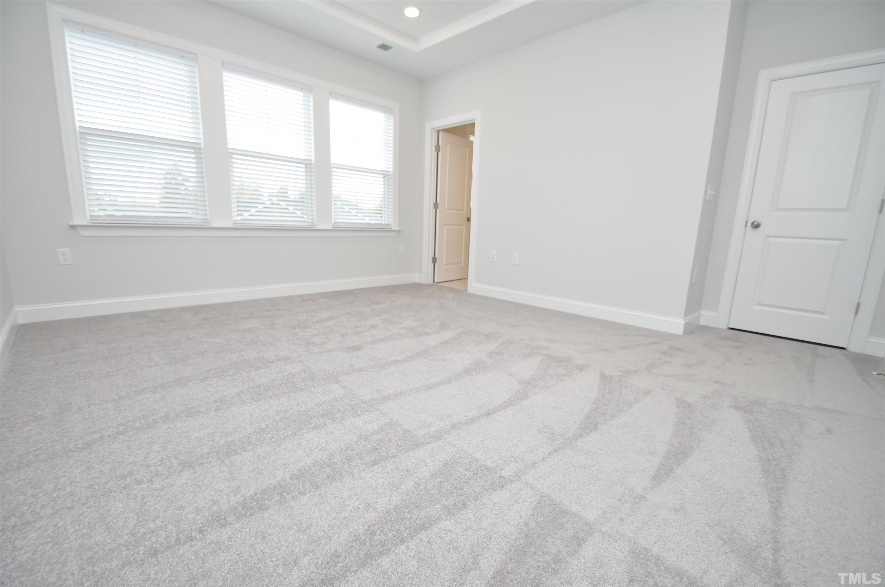 2949 Rise And Shine Road Apex, NC 27523 - Photo 26 of 49 an empty room with windows