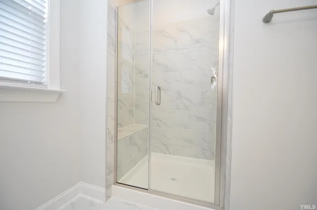 a white toilet sitting next to a window