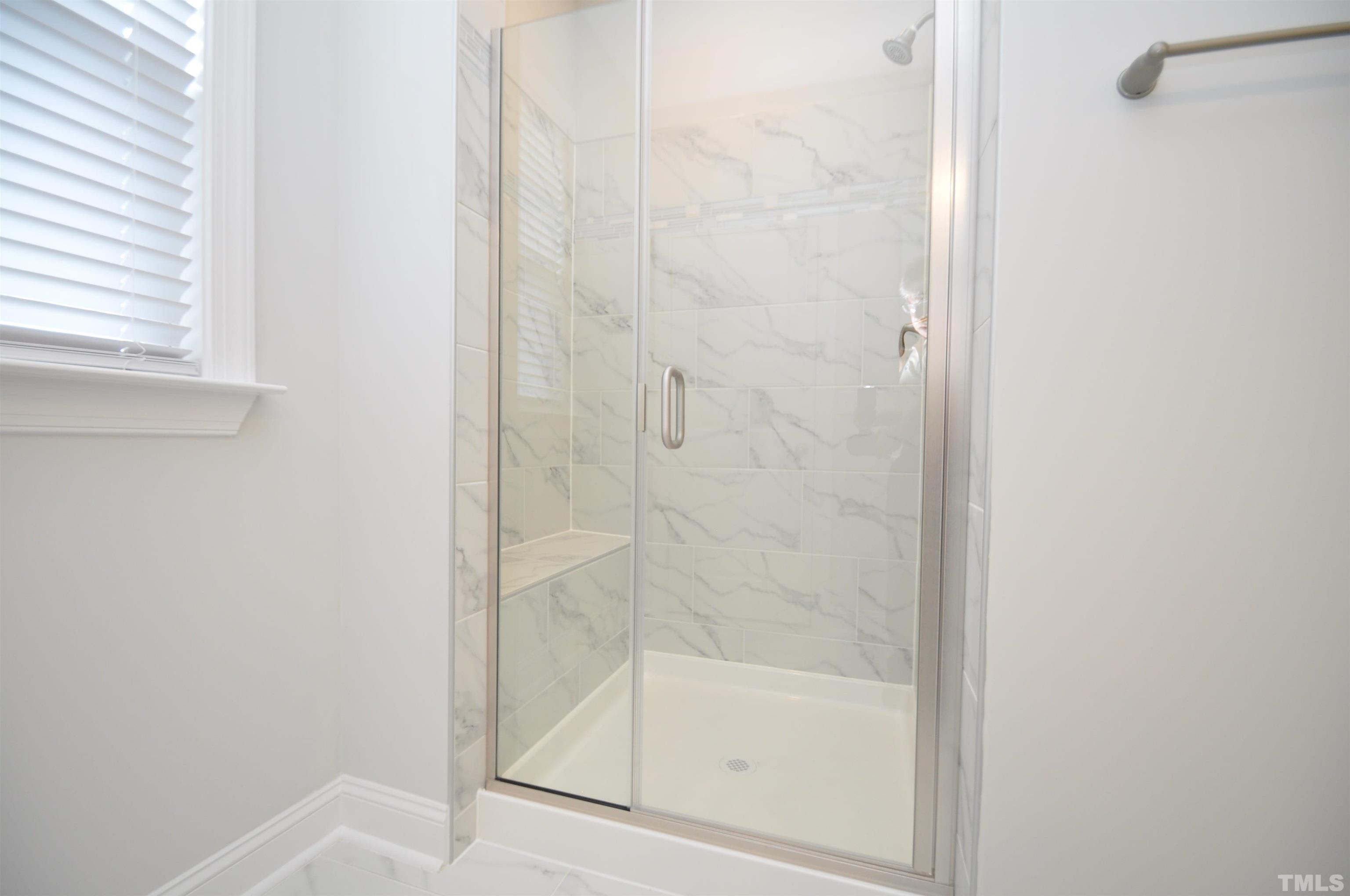 2949 Rise And Shine Road Apex, NC 27523 - Photo 31 of 49 a bathroom with a bathtub
