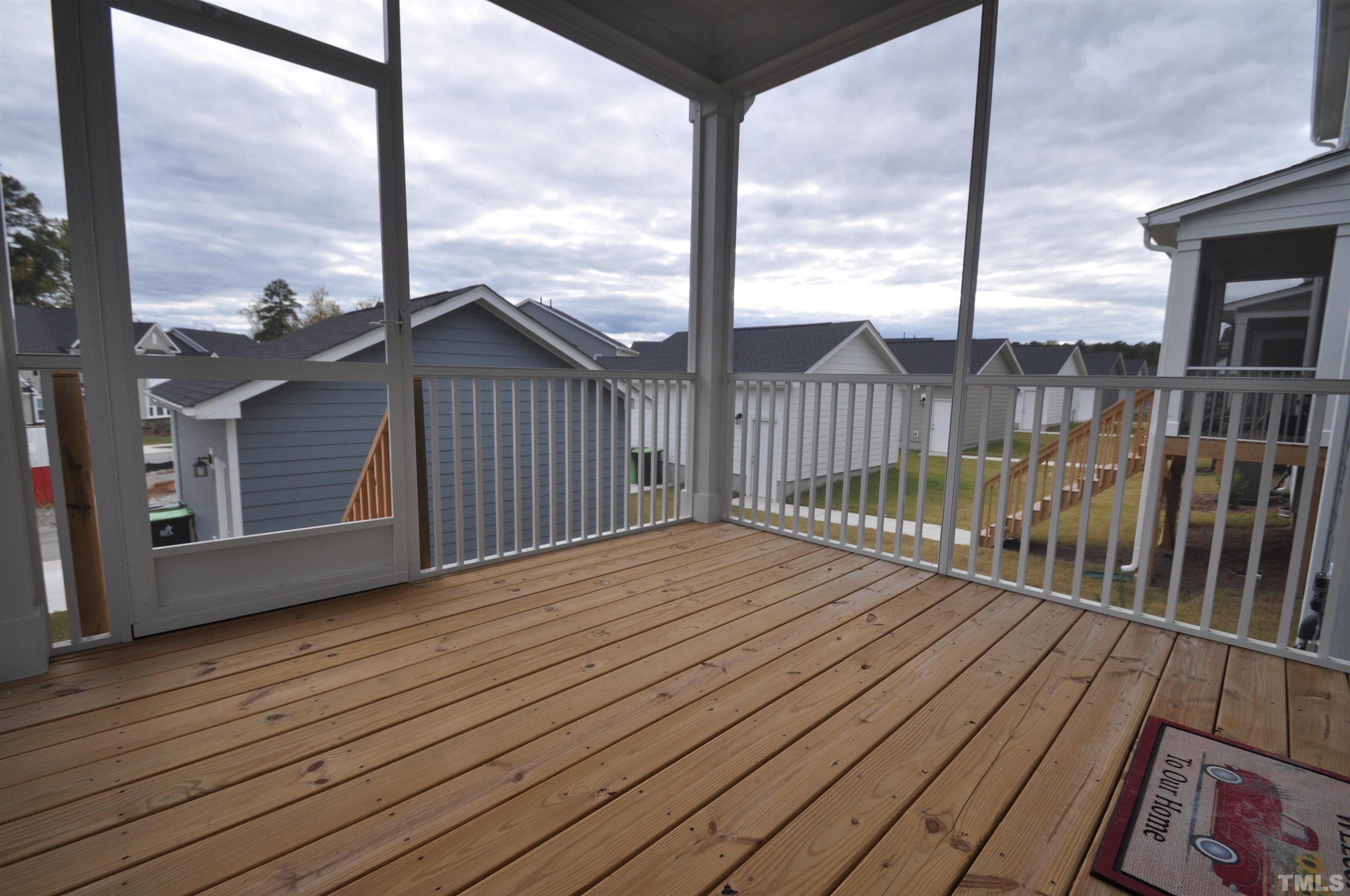 2949 Rise And Shine Road Apex, NC 27523 - Photo 34 of 49 a view of a balcony with wooden floor