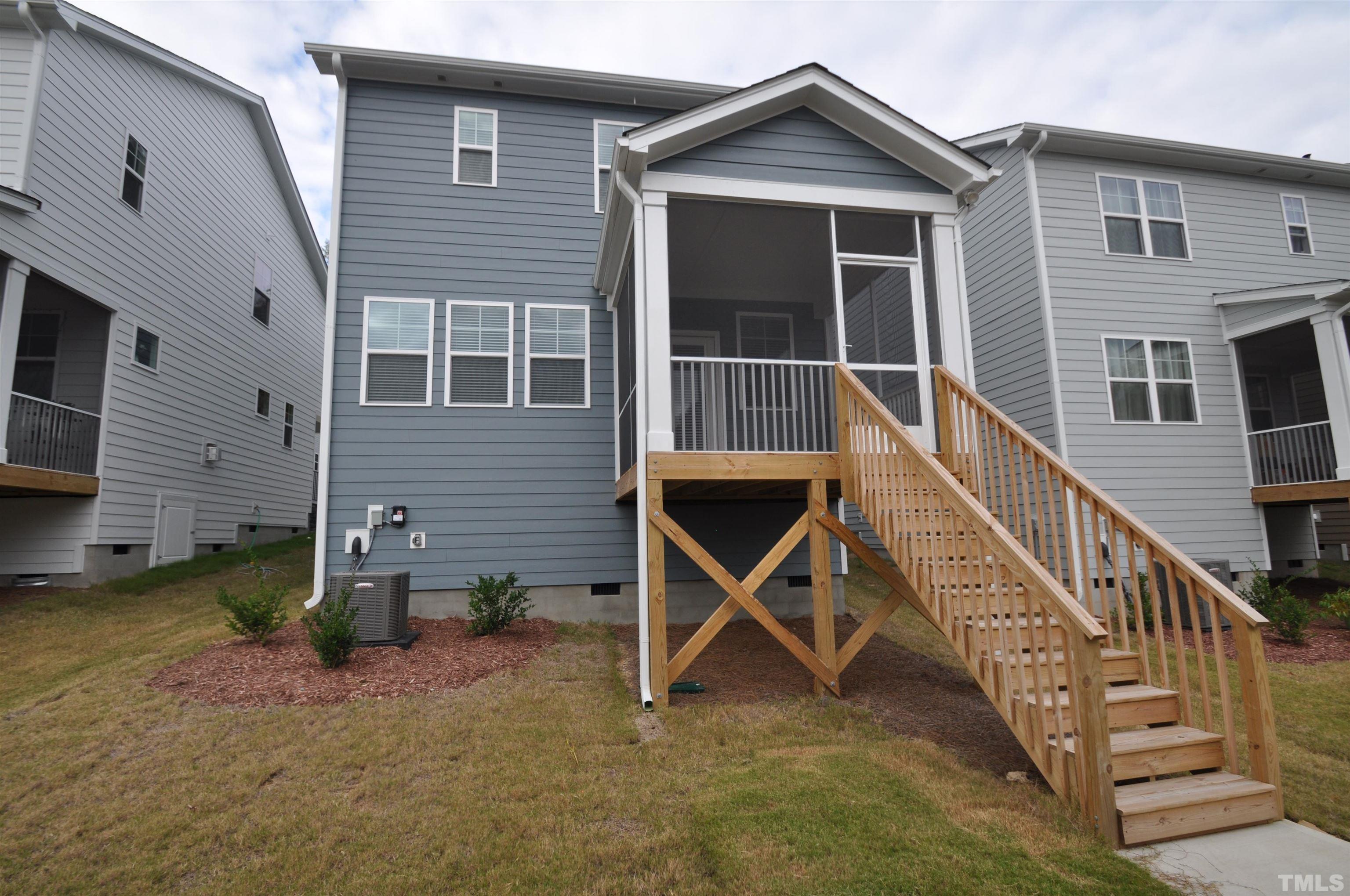 2949 Rise And Shine Road Apex, NC 27523 - Photo 37 of 49 a view of two house with wooden deck and a table