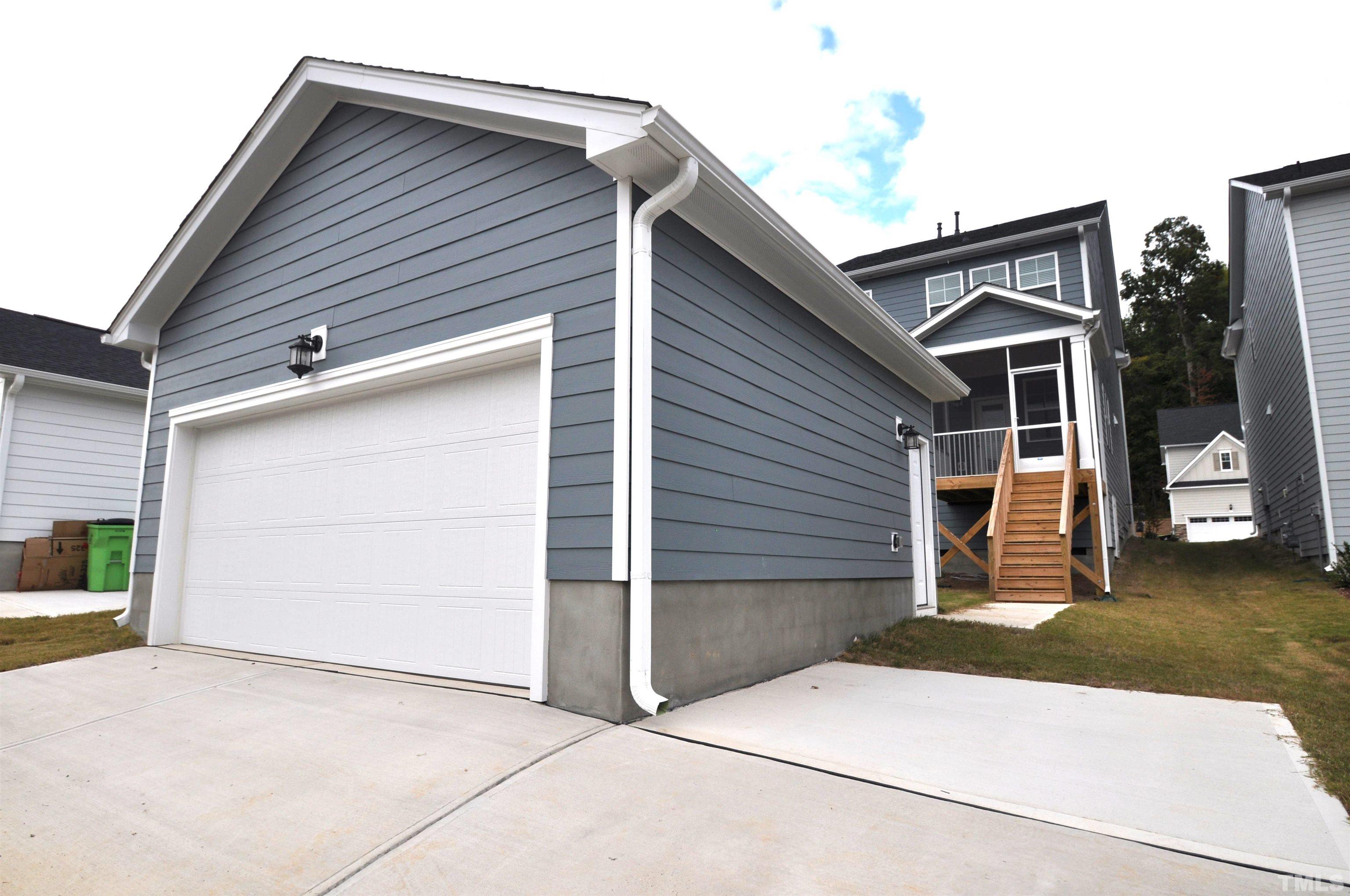 2949 Rise And Shine Road Apex, NC 27523 - Photo 41 of 49 a view of house with garage and yard