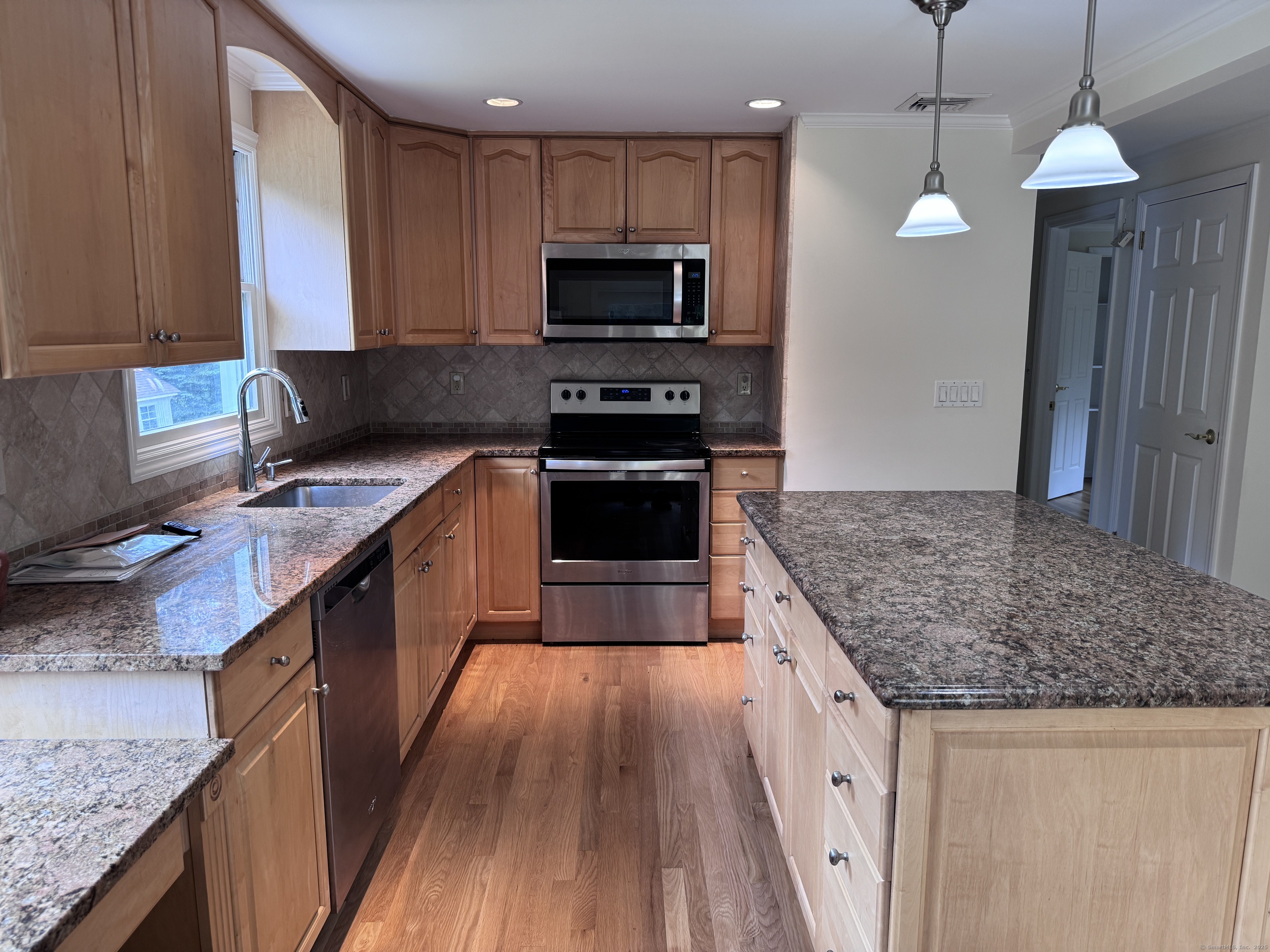 18 Hales Road Westport, CT 06880 - Photo 6 of 26 a kitchen with granite countertop a sink stove and refrigerator