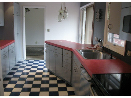 3215 North View Road Rockford, IL 61107 - Photo 5 of 11 a kitchen with a sink a stove and a refrigerator