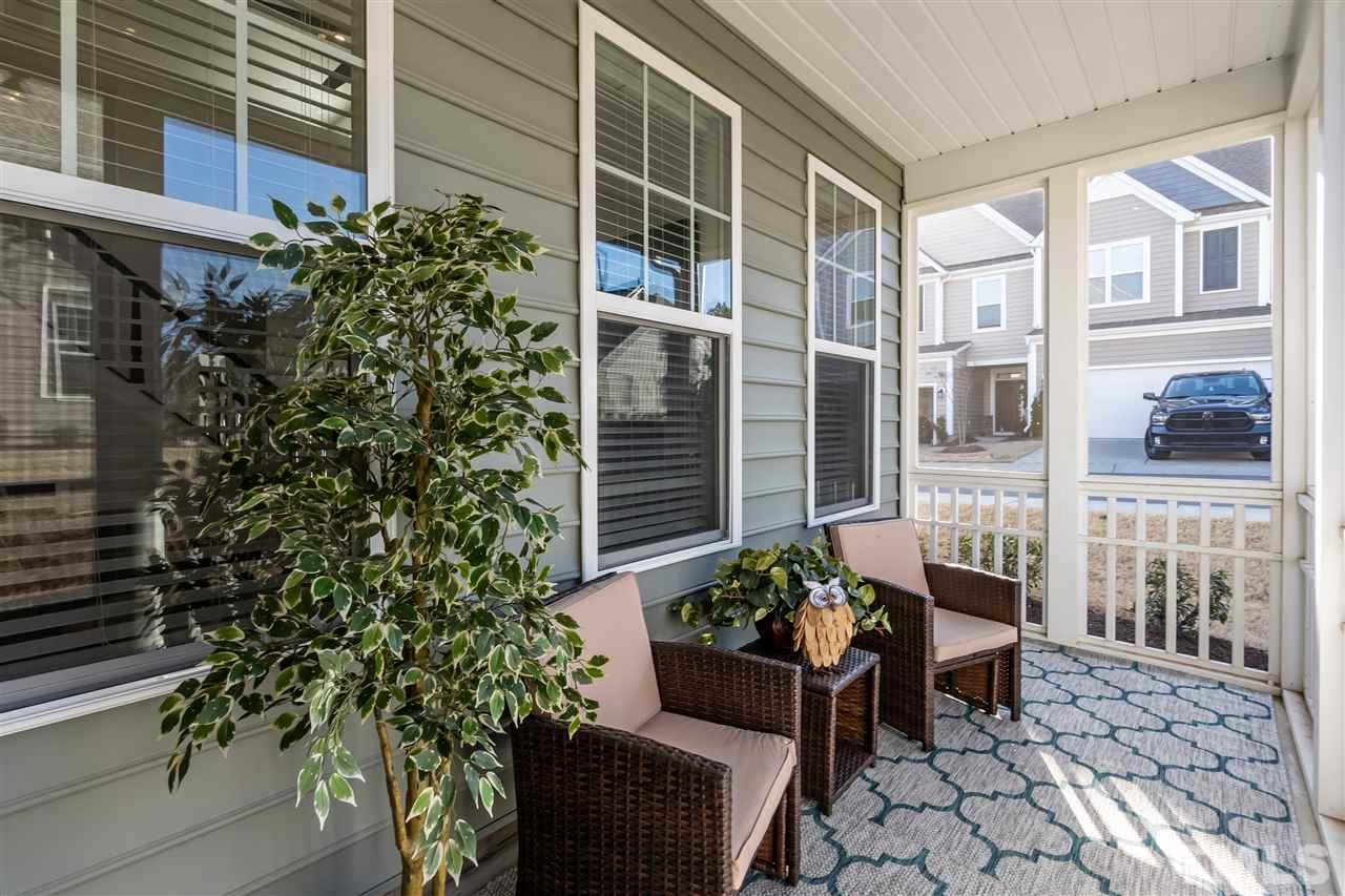 3 Moss Side Terrace Durham, NC 27703 - Photo 16 of 30 a house with lots of potted plants and a fountain