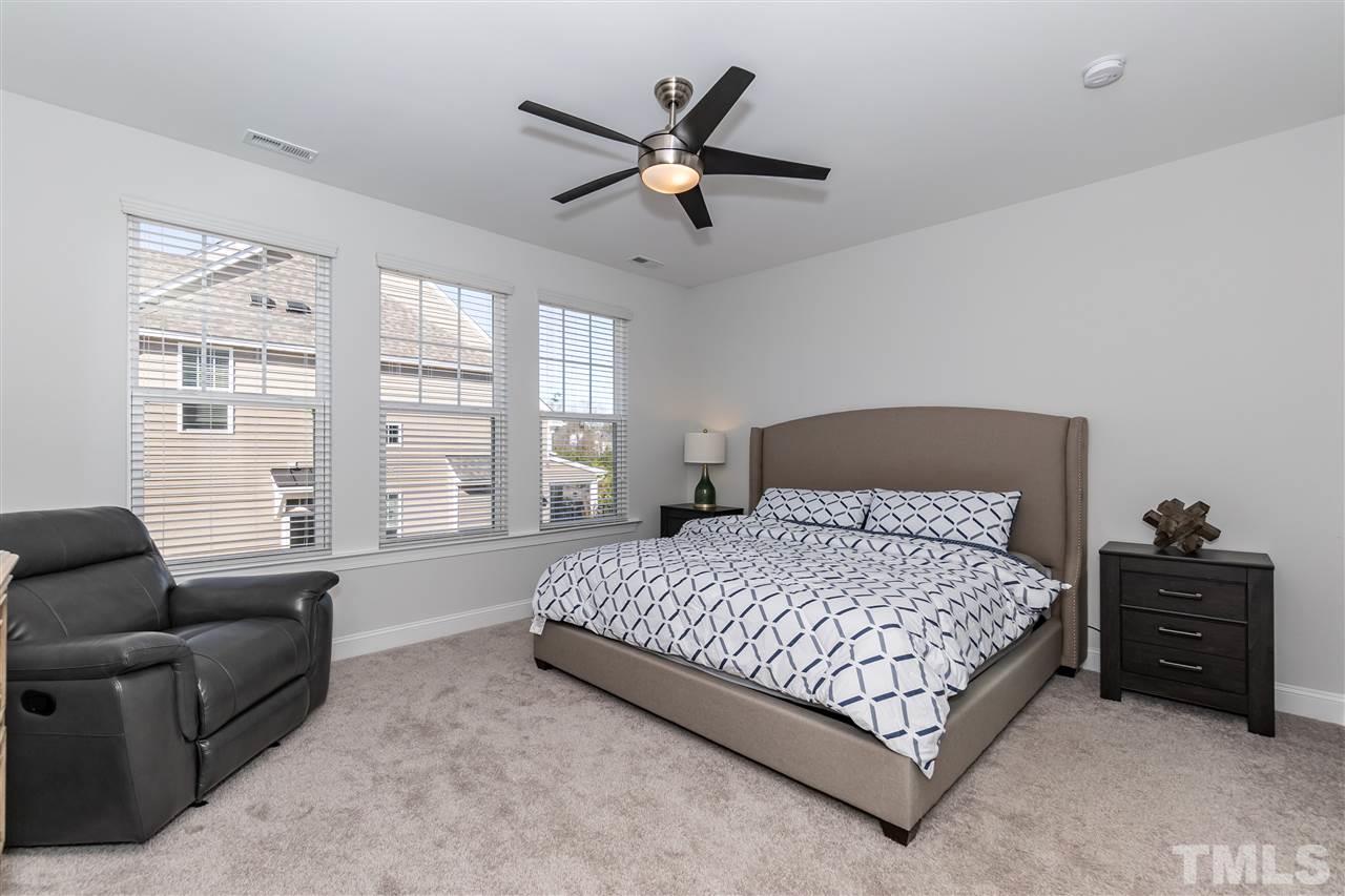 3 Moss Side Terrace Durham, NC 27703 - Photo 17 of 30 a bedroom with a bed a couch and a window