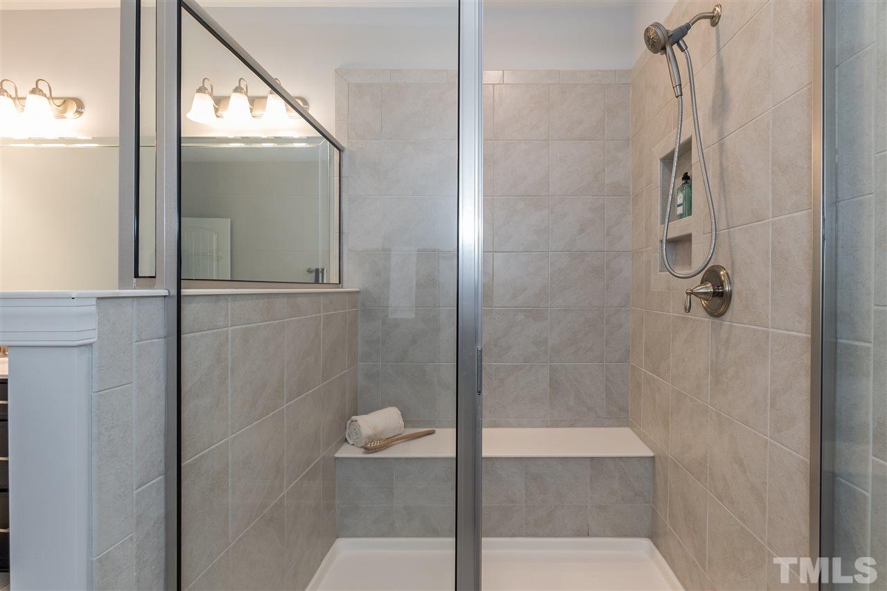 3 Moss Side Terrace Durham, NC 27703 - Photo 20 of 30 a bathroom with a glass shower door