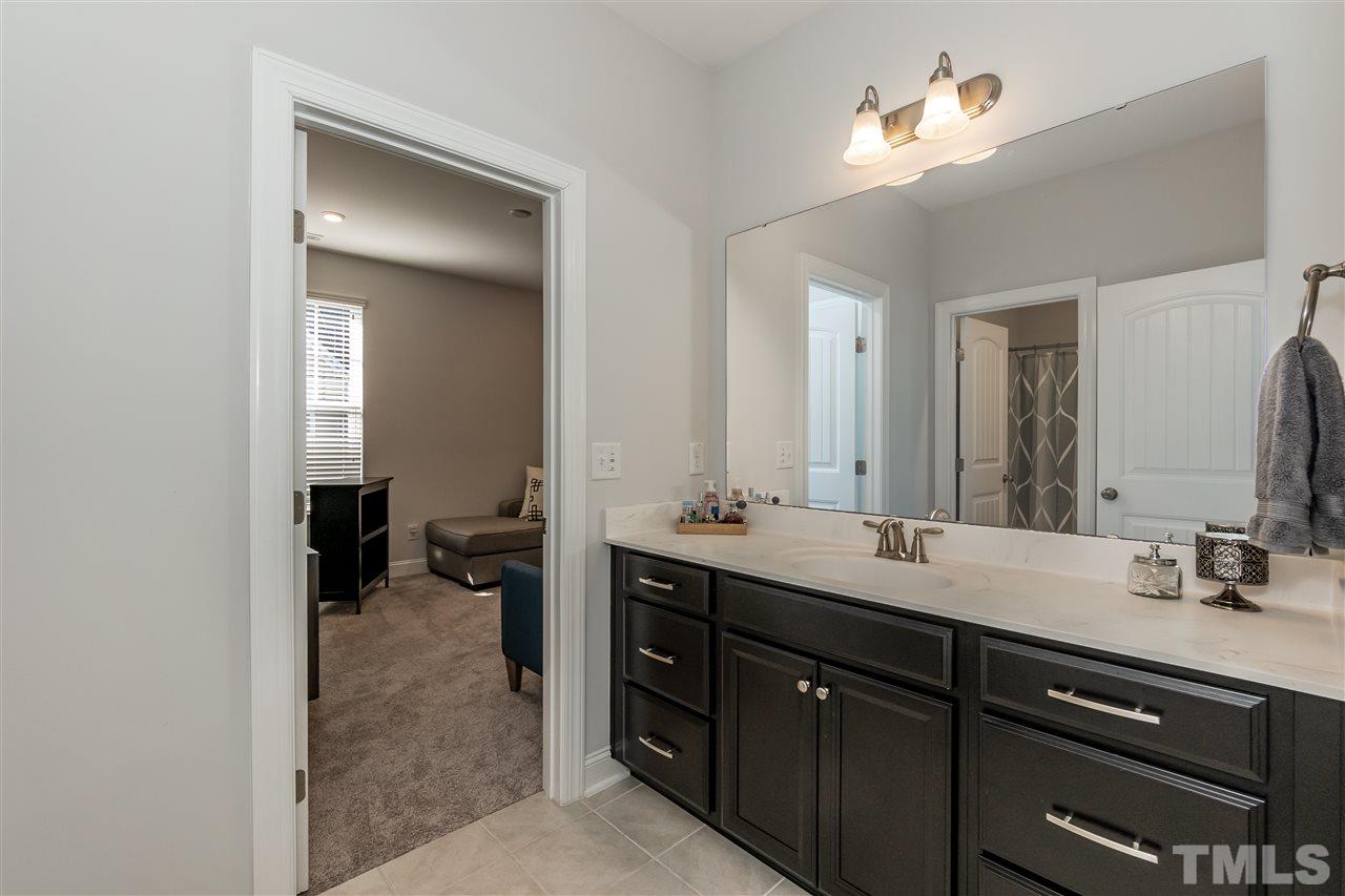 3 Moss Side Terrace Durham, NC 27703 - Photo 22 of 30 a bathroom with a double vanity sink and a mirror