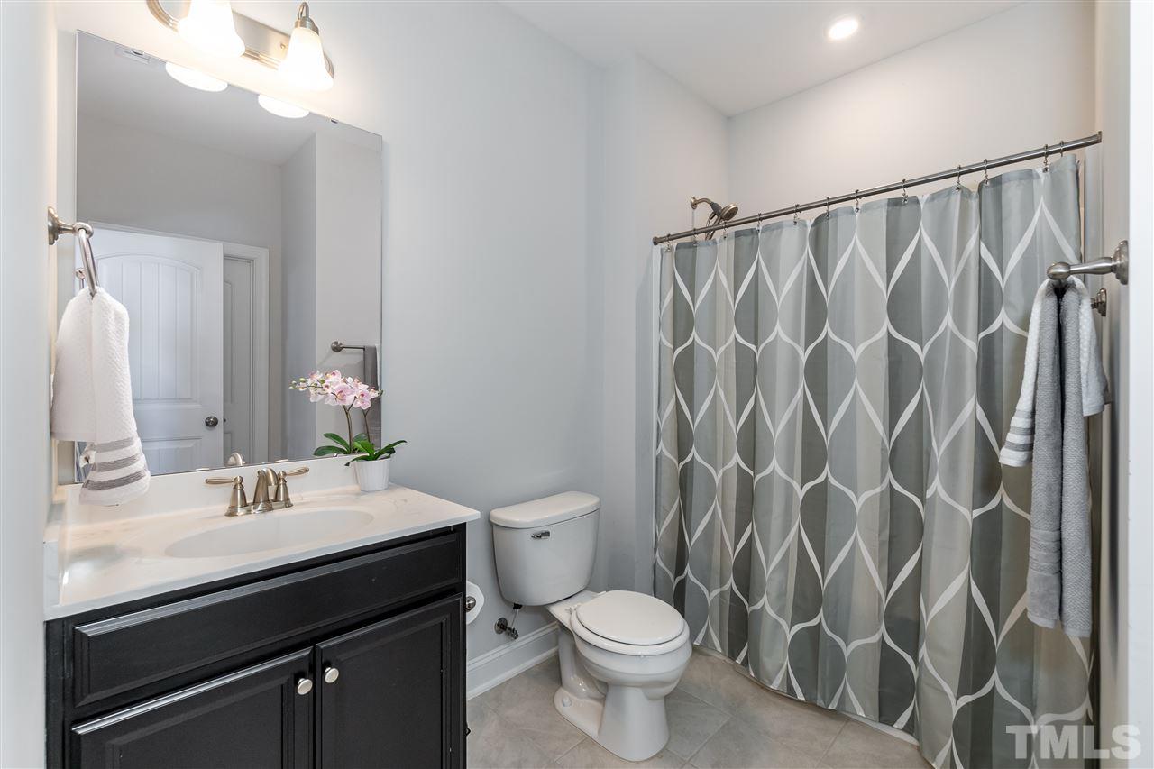 3 Moss Side Terrace Durham, NC 27703 - Photo 24 of 30 a bathroom with a sink toilet and shower