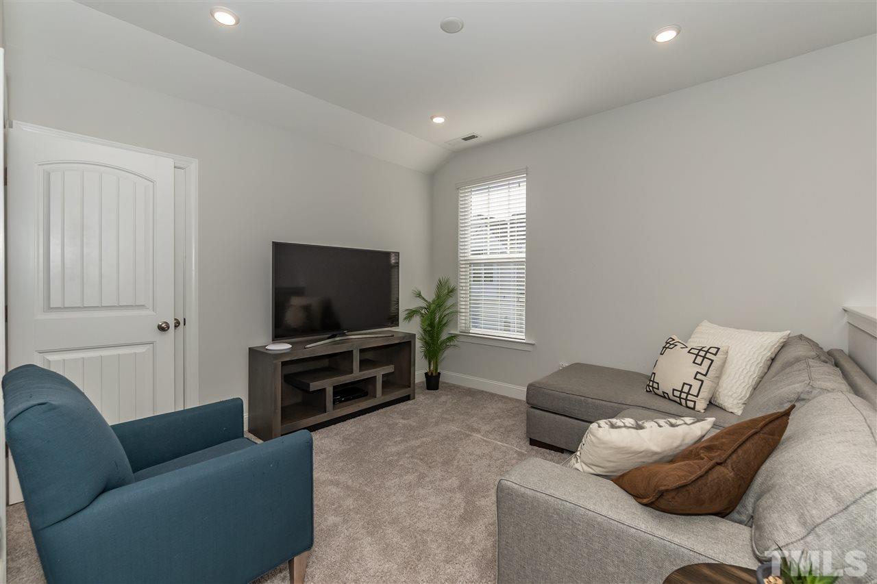 3 Moss Side Terrace Durham, NC 27703 - Photo 25 of 30 a living room with furniture and a flat screen tv