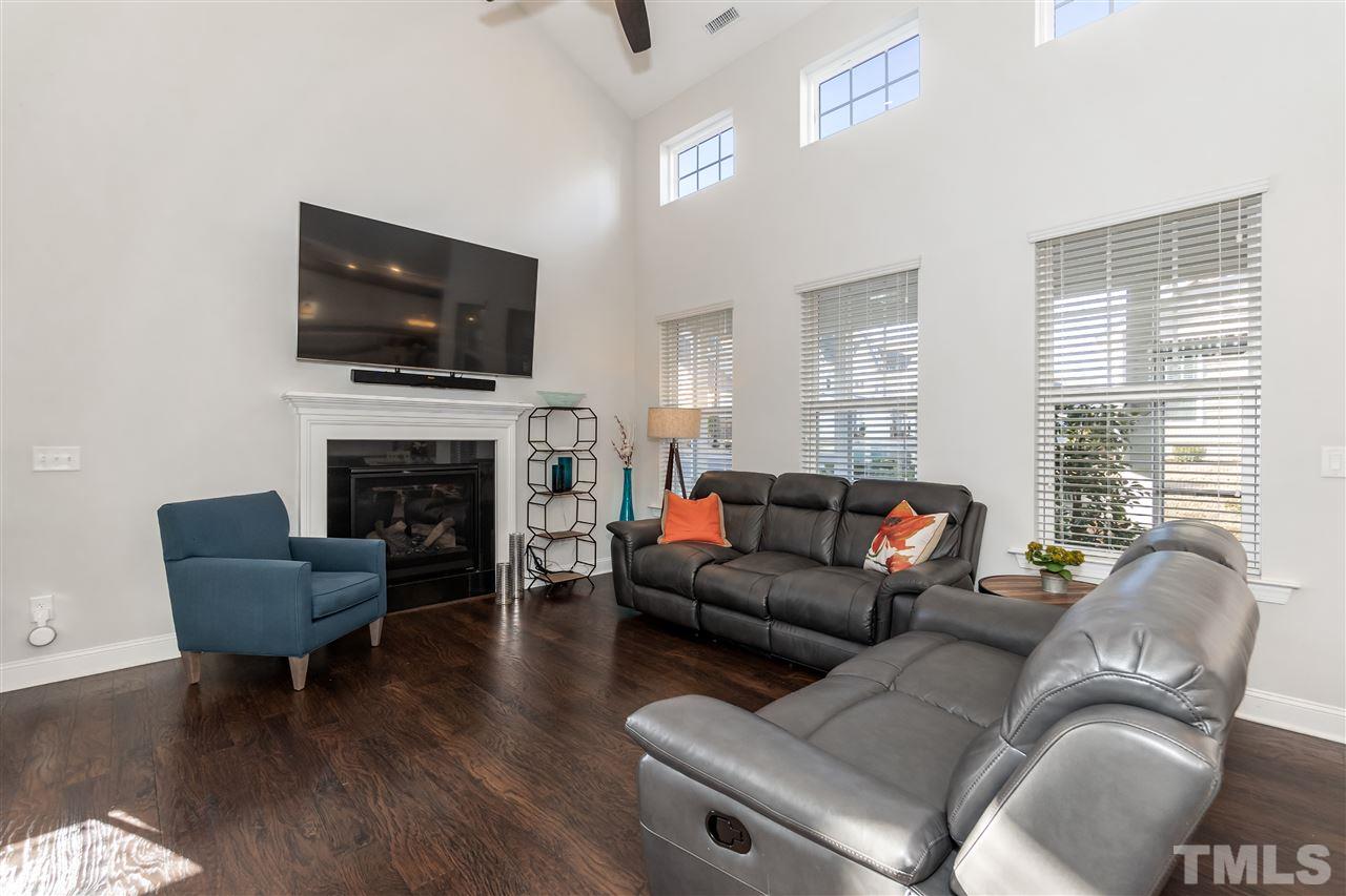 3 Moss Side Terrace Durham, NC 27703 - Photo 7 of 30 a living room with furniture a flat screen tv and a fireplace
