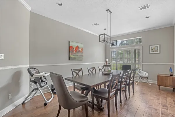 a bathroom with a granite countertop sink a toilet and a large mirror