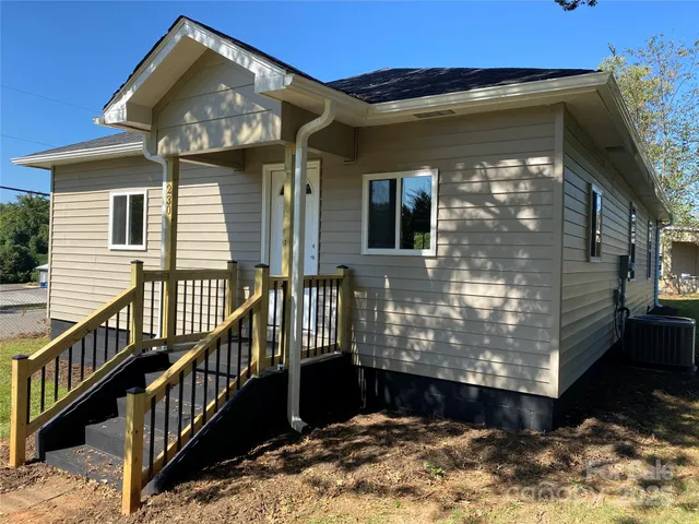 a house with trees in the background