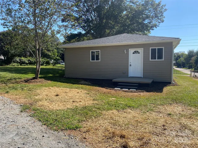 a backyard of a house with lots of green space