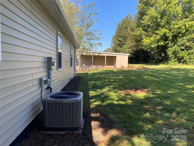 a view of an house with backyard space and garden