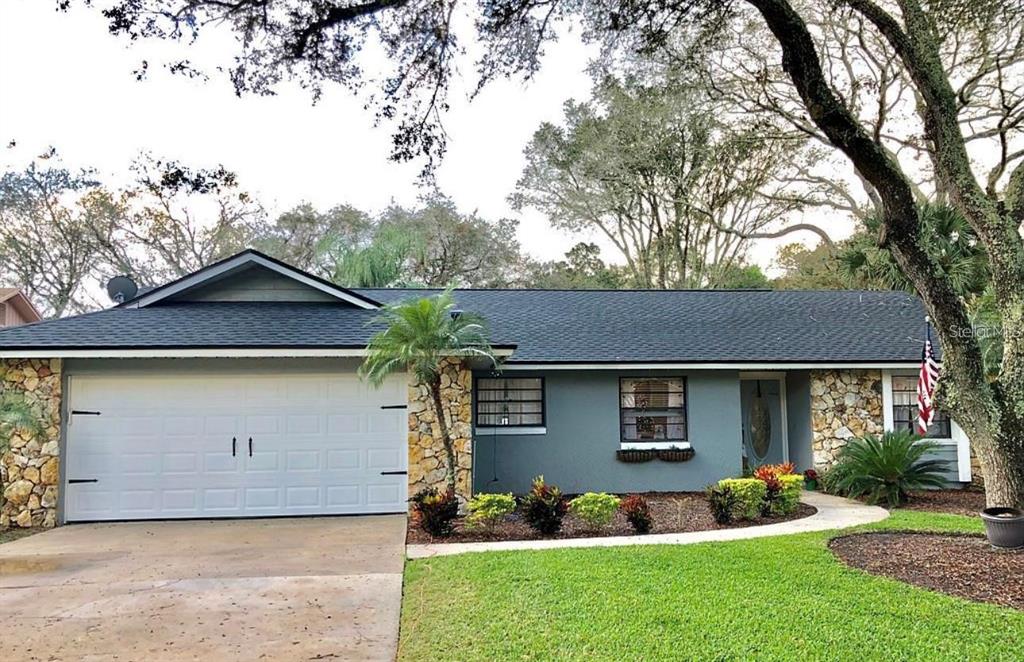 641 Heather Brite Circle Apopka, FL 32712 - Photo 1 of 1 a front view of a house with a garden and plants