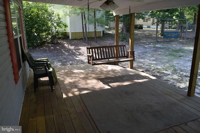 a view of backyard with deck