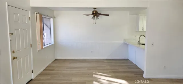 a view of a kitchen from the hallway