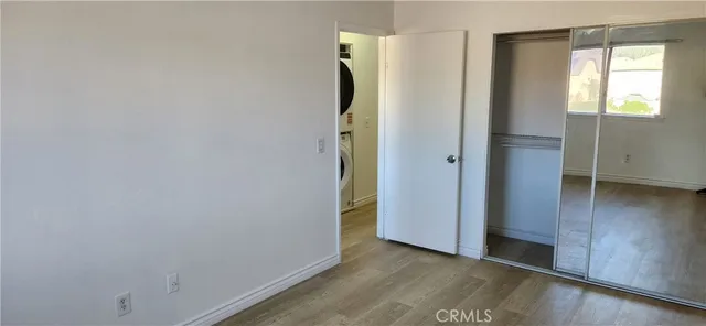 an empty room with wooden floor