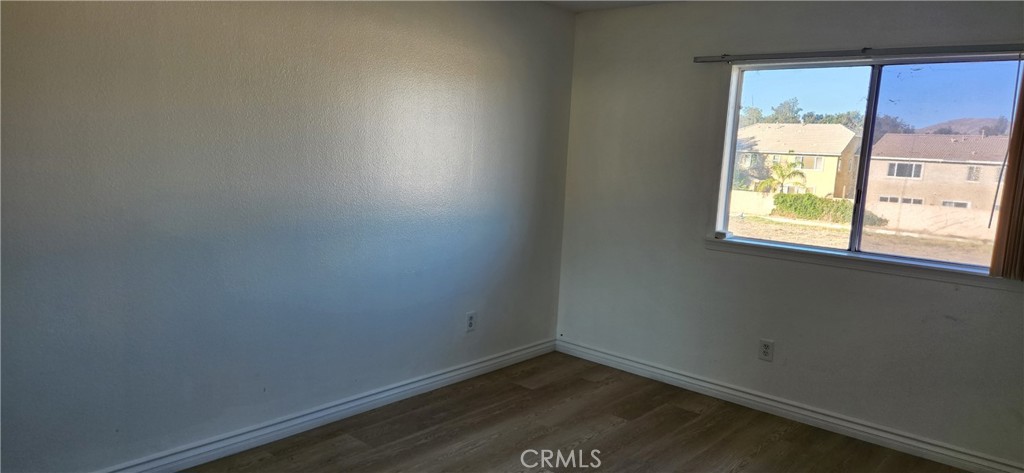 713 Walnut Drive Lake Elsinore, CA 92530 - Photo 16 of 28 an empty room with a window
